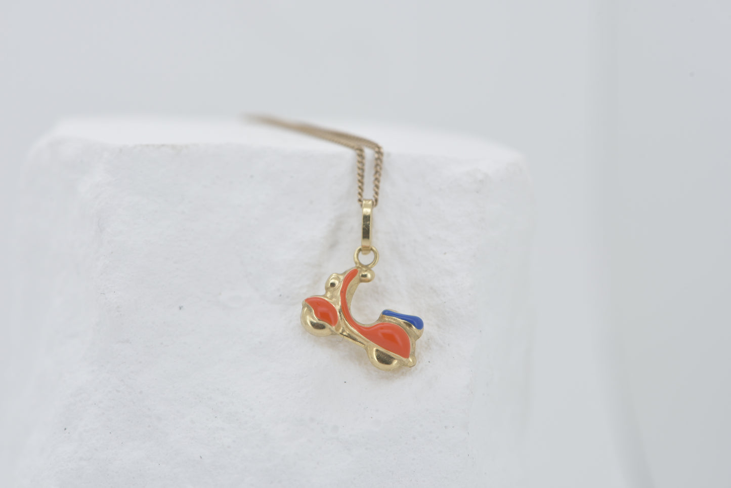 Vespa charm in 9ct yellow gold with orange and blue enamel