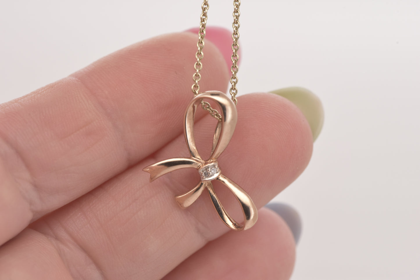Rose gold bow pendant with tiny diamond accent 9ct rose gold