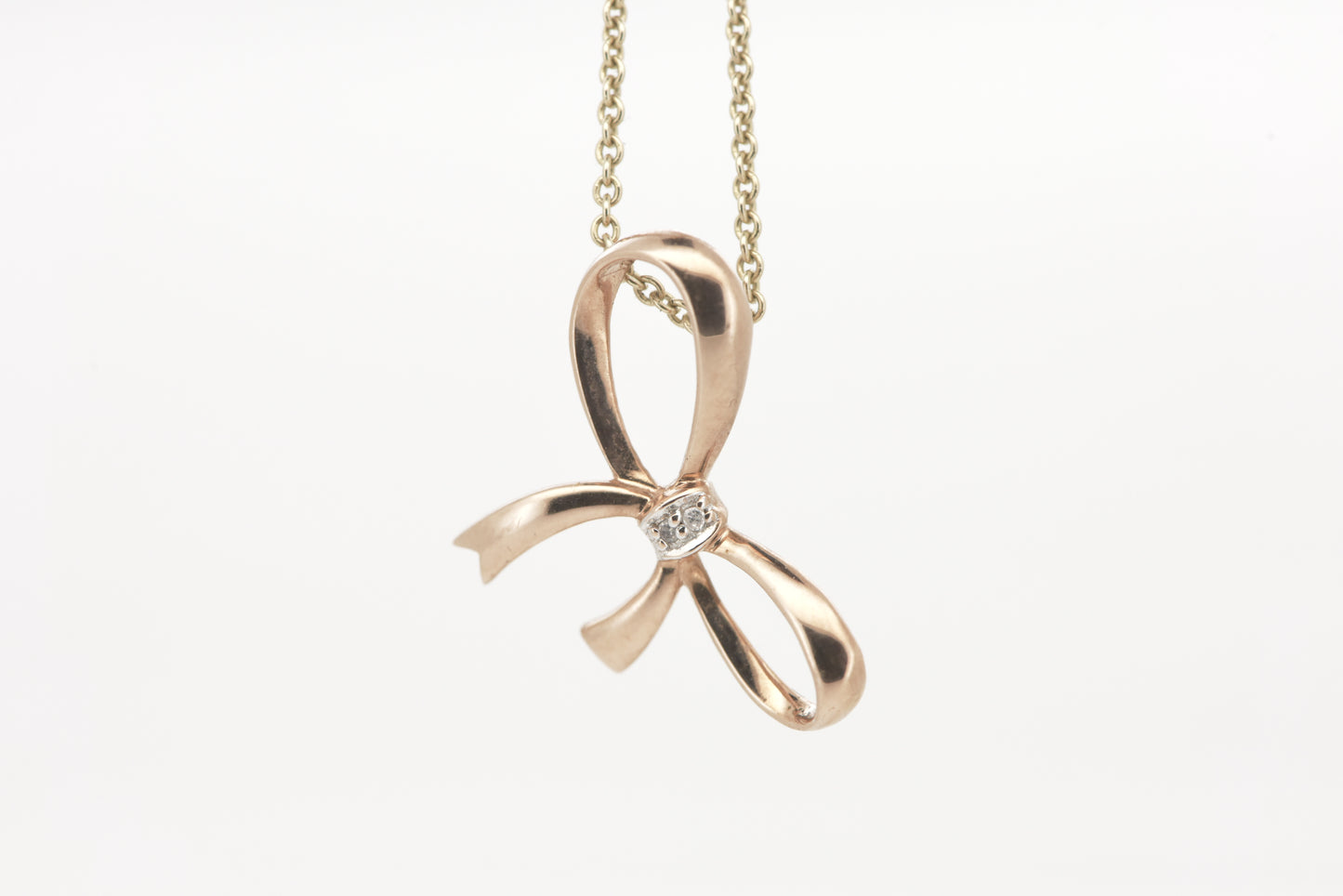 Rose gold bow pendant with tiny diamond accent 9ct rose gold