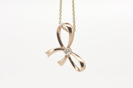 Rose gold bow pendant with tiny diamond accent 9ct rose gold