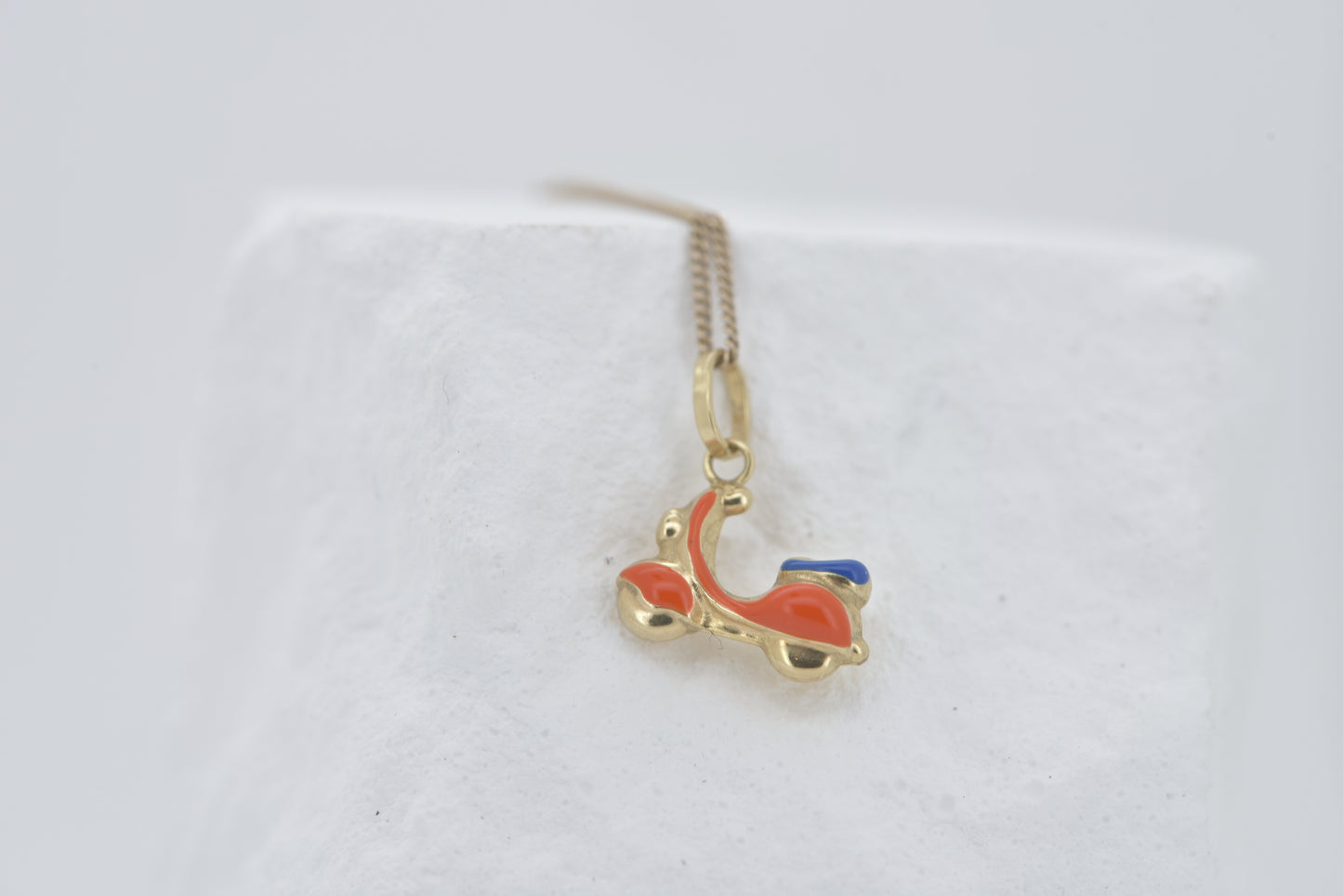 Vespa charm in 9ct yellow gold with orange and blue enamel
