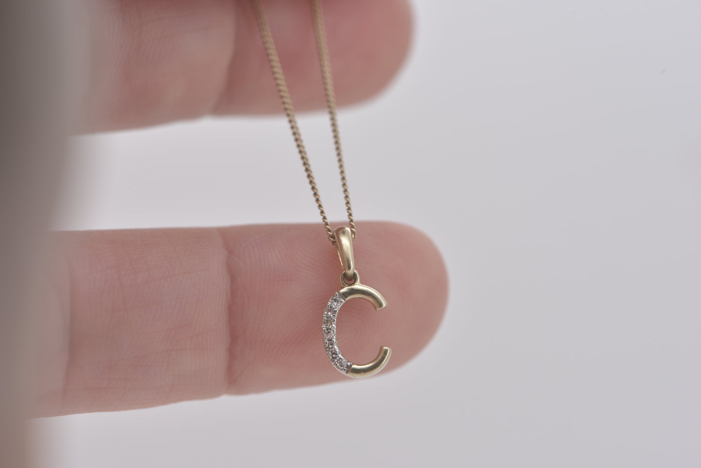 Letter C yellow gold with diamonds