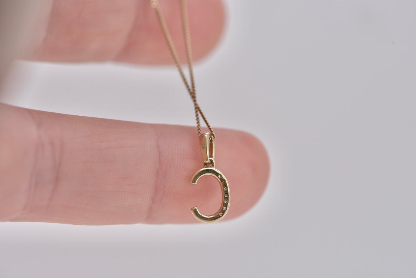 Letter C yellow gold with diamonds